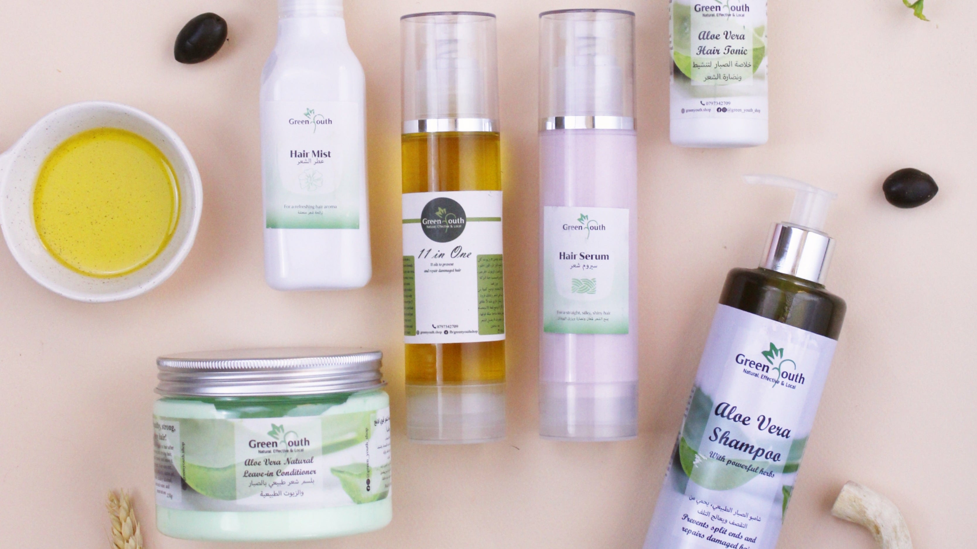 Collection of Green People hair care products on a beige background with natural elements.